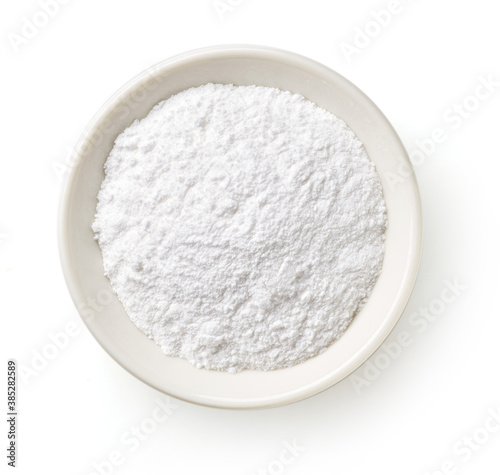Bowl of baking powder isolated on white, from above