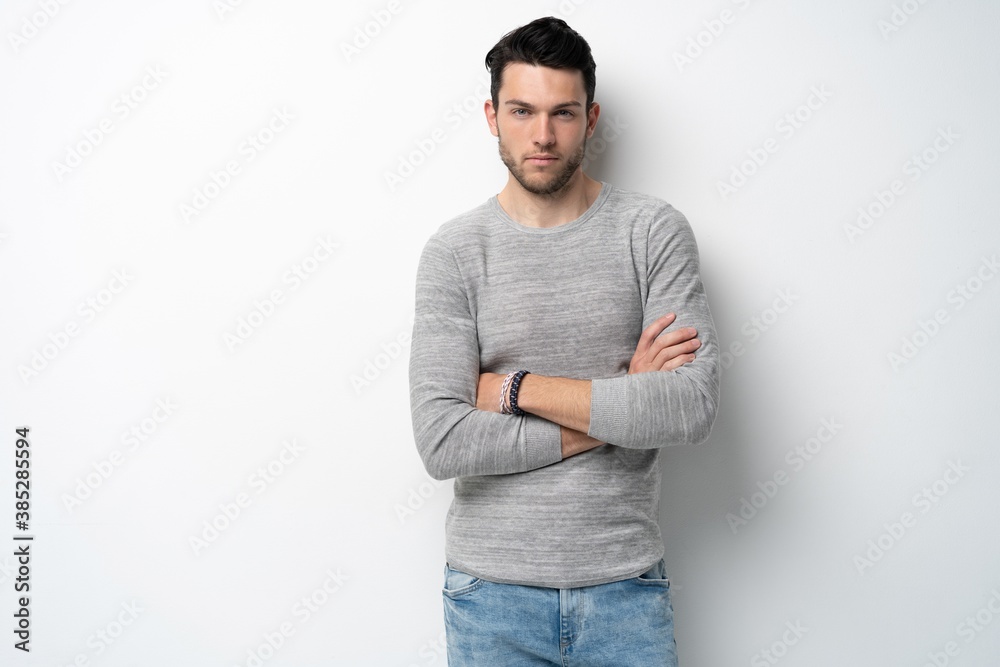 Handsome young man on white background looking at camera. Happy guy smiling. Handsome young man on white background looking at camera. Happy guy smiling.
