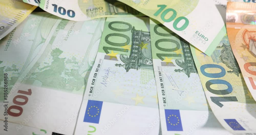 Stack of euro banknotes isolated on a black table.. Financial crisis. Purchasing power of money. money laundering Stack of euro banknotes isolated on a black table.. Financial crisis. Purchasing power of money. money laundering