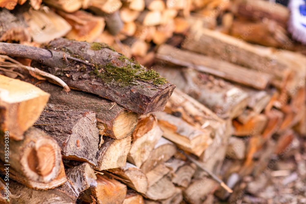 Christmas texture background of dry wooden log cabins. Woodpile of cut Lumber for forestry industry Christmas texture background of dry wooden log cabins. Woodpile of cut Lumber for forestry industry