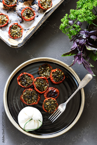 Provencal Tomatoes. Baked Tomatoes with parsley, garlic and olive oil served with burrata cheese