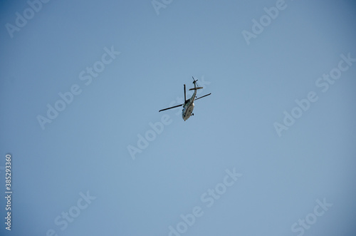 helicopter flying on blue sky