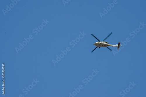 helicopter flying on blue sky