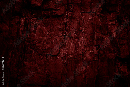 Toned rock texture. Black red stone background. Detail. Dark colored grunge background. © Наталья Босяк