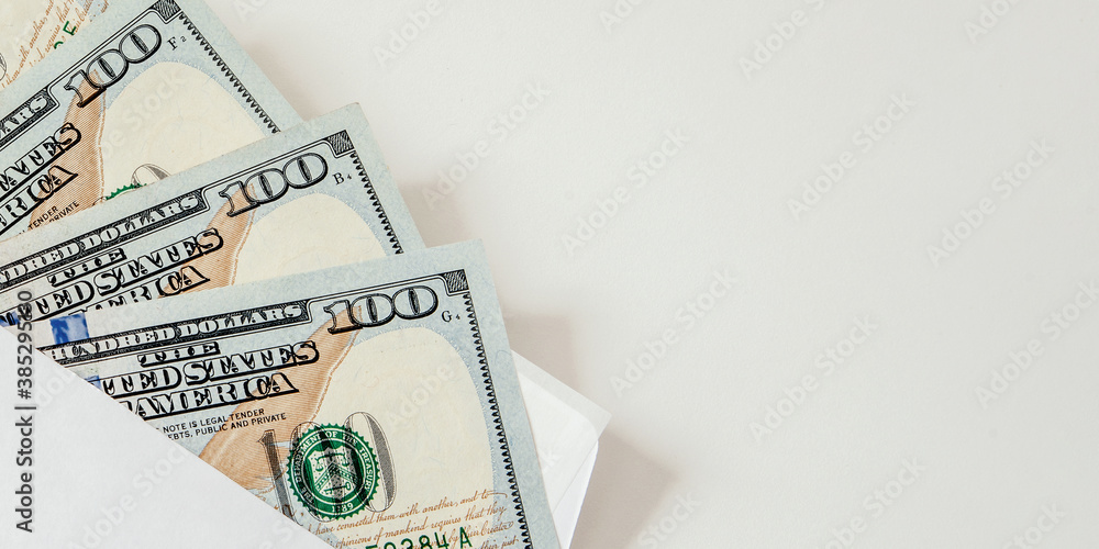 dollars bills money in paper envelope on white table bribe and corruption concept dollars bills money in paper envelope on white table bribe and corruption concept