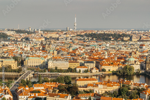 Aerial postcard view of Prague,Czechia. Prague panorama.Beautiful sunny landscape of the capital of Czechia.Amazing European cityscape.Red roofs,bridges over Vltava river,TV tower.Travel scenery.