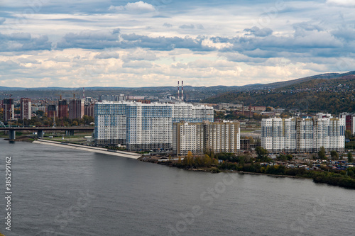 Panoramic view of the city across the river. © Vectorina
