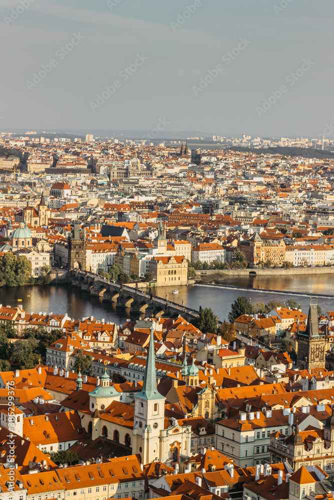 Aerial postcard view of Prague,Czechia. Prague panorama.Beautiful sunny landscape of the capital of Czechia.Amazing European cityscape.Red roofs,bridges over Vltava river.Travel urban scenery.