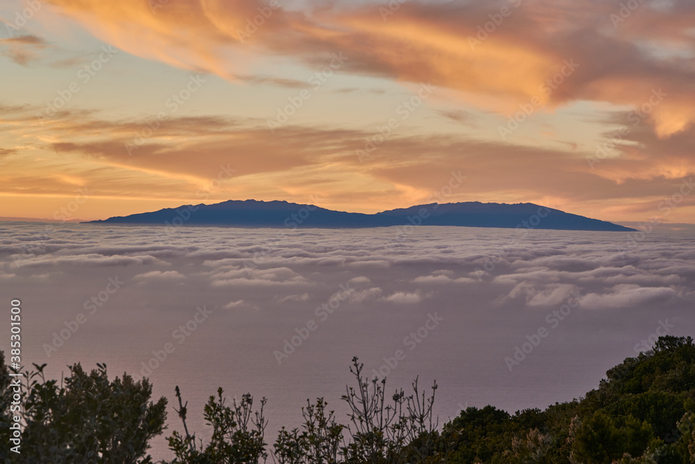 Beautiful sunset in La Gomera with view on el Hierro. Sunset above the atlantic ocean with view on an island.