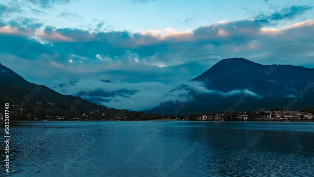 Naklejka premium Beautiful alpine sunset view with Rottach-Egern in the background at the famous Tegernsee, Bavaria, Germany