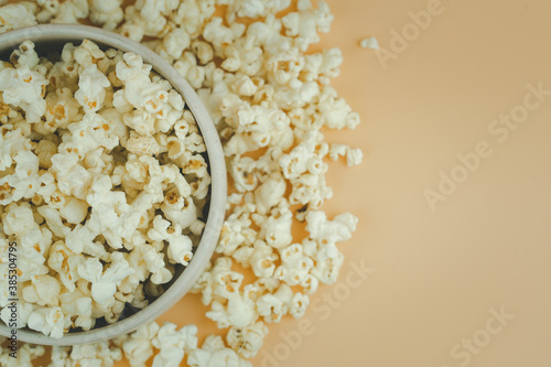 Popcorn viewed from above on yellow background