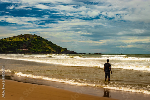 man watching the pristine sea view at morning from flat angle
