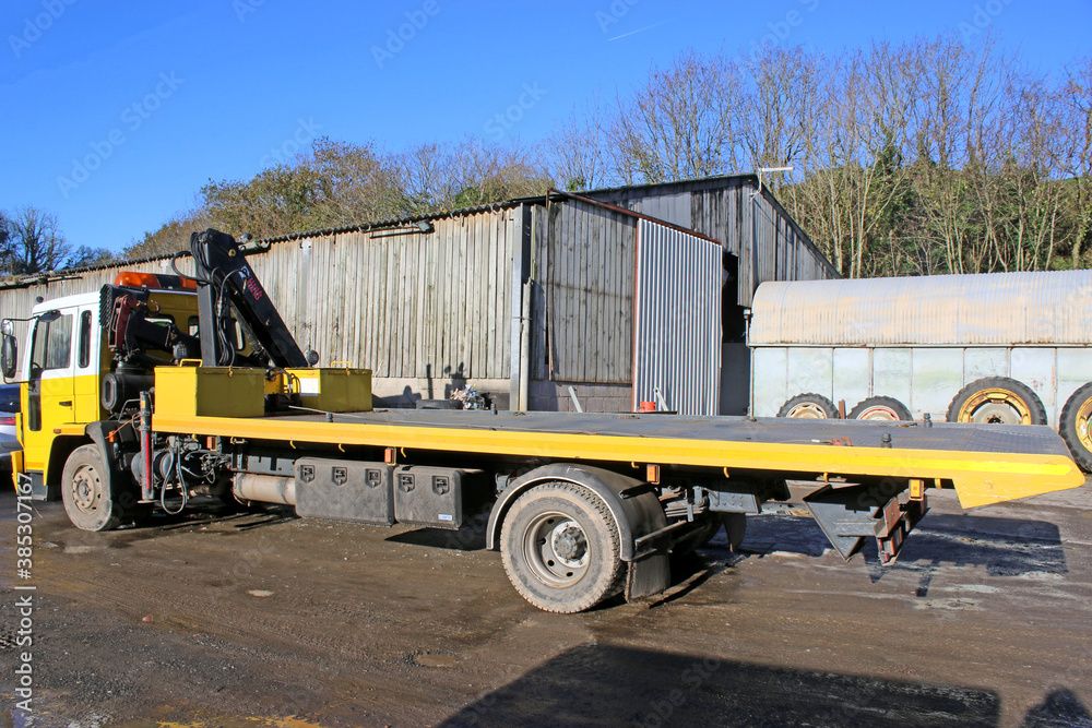 Recovery Truck in a yard	