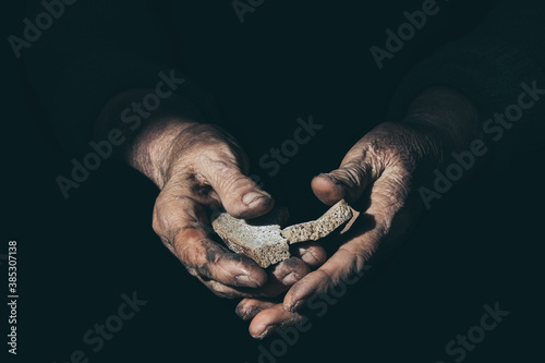 dried bread in the hands of an old woman