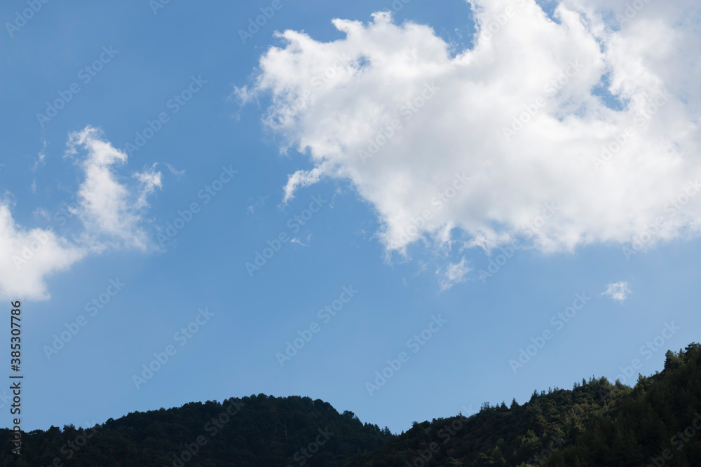 The perfect harmony of mountain and cloud with the sky The perfect harmony of mountain and cloud with the sky