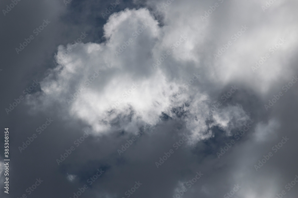 Dark and Dramatic Storm Clouds with sunlight in the background