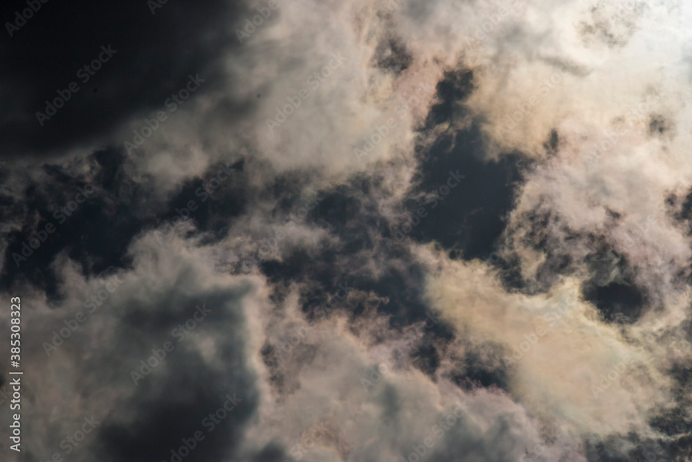 Dark and Dramatic Storm Clouds with sunlight in the background