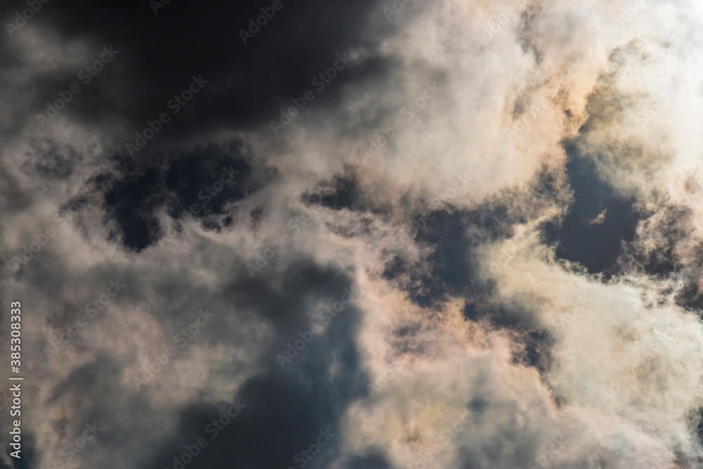Dark and Dramatic Storm Clouds with sunlight in the background Dark and Dramatic Storm Clouds with sunlight in the background