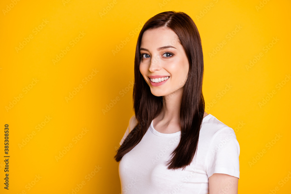 Turned photo of content candid girl look in camera beaming smile wear casual style clothes isolated over vivid color background Turned photo of content candid girl look in camera beaming smile wear casual style clothes isolated over vivid color background