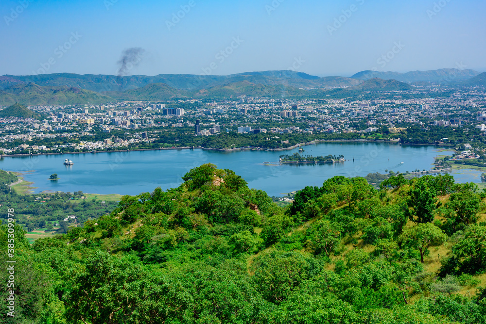 Panoramic aerial view of Udaipur city also known as city of lakes from  Monsoon palace at Sajjangarh, Rajasthan. It is the historic capital of the kingdom of Mewar.