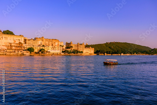 View of Pichola Lake near Udaipur city palace. It is an artificial lake popular for boating among tourist who visits City of lakes to enjoy vacations in Rajasthan