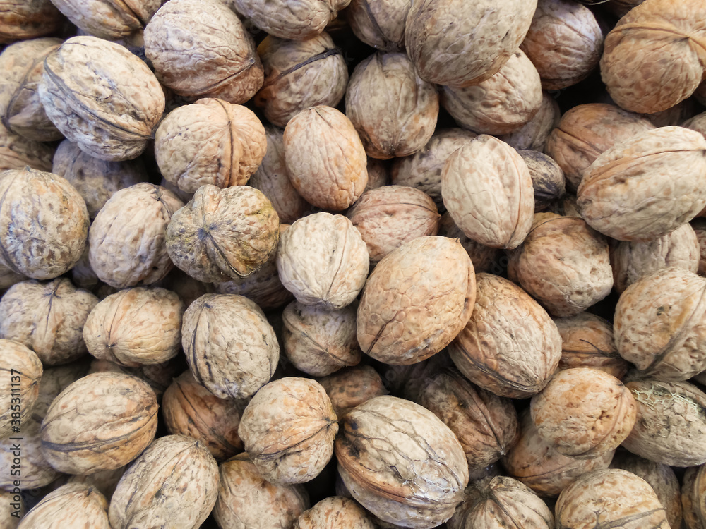 Walnuts background. Walnuts texture. Walnuts background. Organic food. Walnuts background. Walnuts texture. Walnuts background. Organic food.