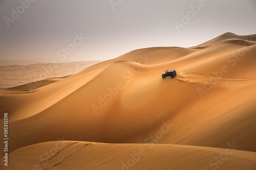 car driving in Rub al Khali Desert at the Empty Quarter  in Abu Dhabi  UAE