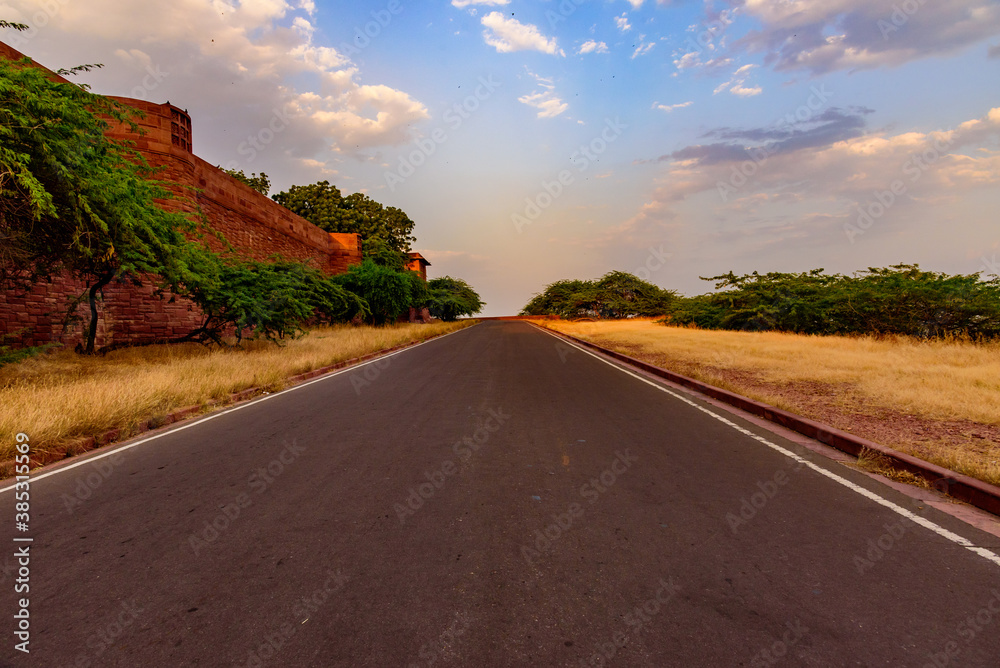 Fototapeta premium View enroute to Umaid Bhawan Palace through precambrian era red sandstone mountains which falls in Jodhpur Group-Malani Igneous Suite Contact geological monument in Aravalli Mountains, Rajasthan