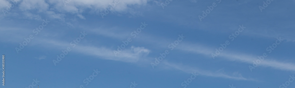 Image of a partly cloudy and partly clear sky during the day Image of a partly cloudy and partly clear sky during the day