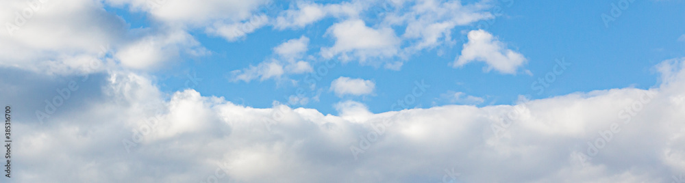 Image of a partly cloudy and partly clear sky during the day Image of a partly cloudy and partly clear sky during the day