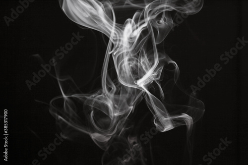 White smoke blot on black background