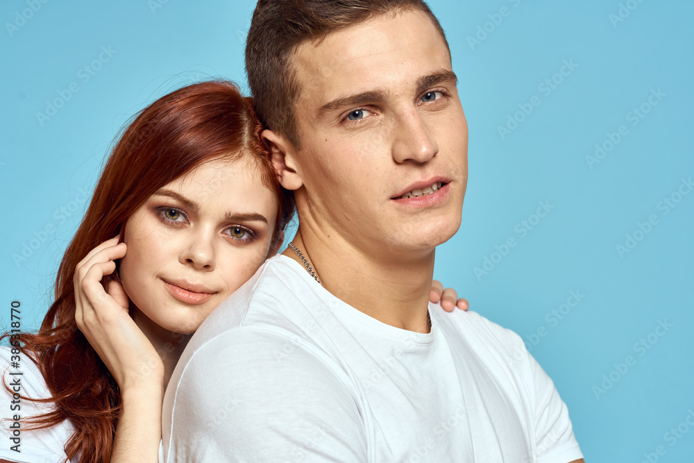 young family love hug cropped view blue background close-up young family love hug cropped view blue background close-up
