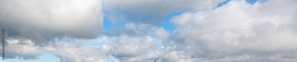 Image of a partly cloudy and partly clear sky during the day Image of a partly cloudy and partly clear sky during the day
