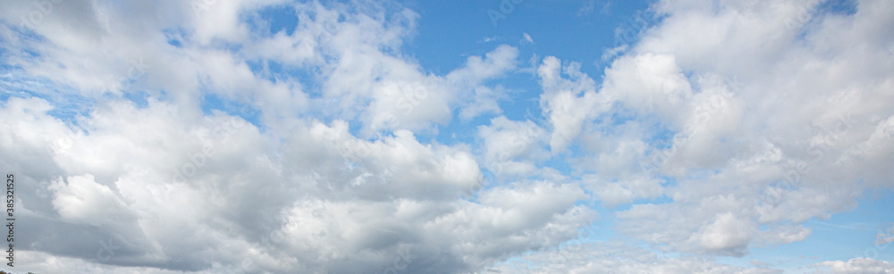Image of a partly cloudy and partly clear sky during the day Image of a partly cloudy and partly clear sky during the day