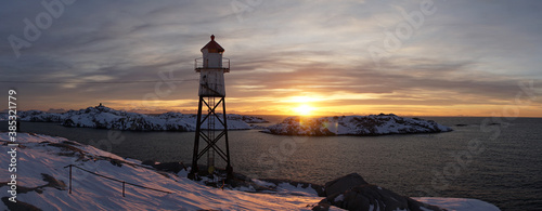 Lighthouse at Henningsvaer Football Stadium during sunrise on the Lofoten Islands in Norway.