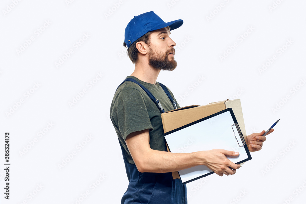 Working male courier with box in hand documents delivery service light background Working male courier with box in hand documents delivery service light background