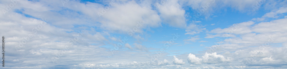 Image of a partly cloudy and partly clear sky during the day Image of a partly cloudy and partly clear sky during the day