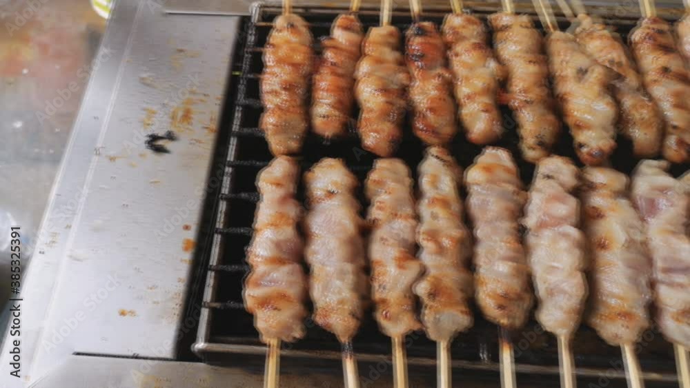 Pork on skewers cooked on the barbecue grill. Street Food Festival. Pork on skewers cooked on the barbecue grill. Street Food Festival.