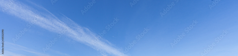 Image of a partly cloudy and partly clear sky during the day Image of a partly cloudy and partly clear sky during the day