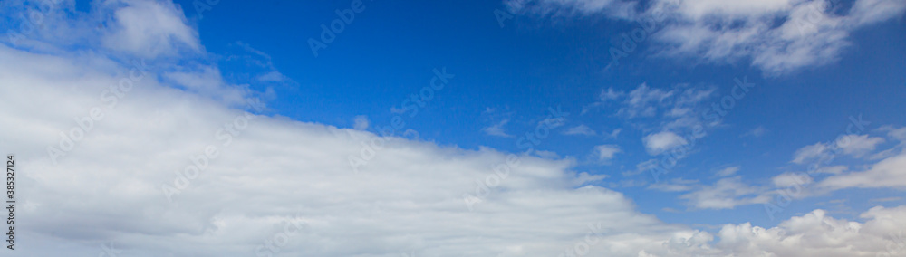 Image of a partly cloudy and partly clear sky during the day Image of a partly cloudy and partly clear sky during the day