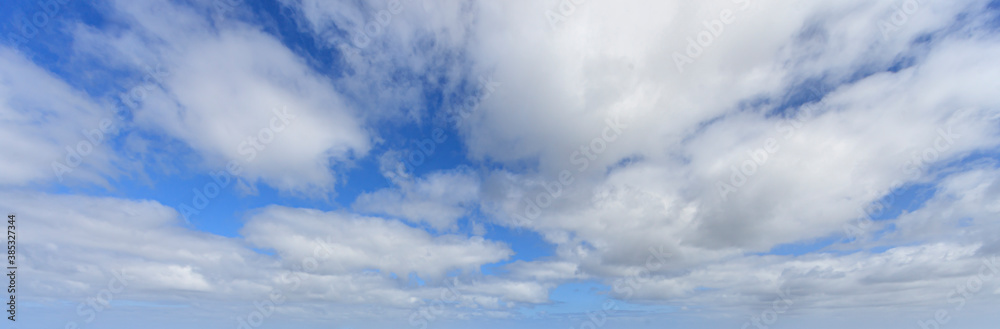 Image of a partly cloudy and partly clear sky during the day Image of a partly cloudy and partly clear sky during the day