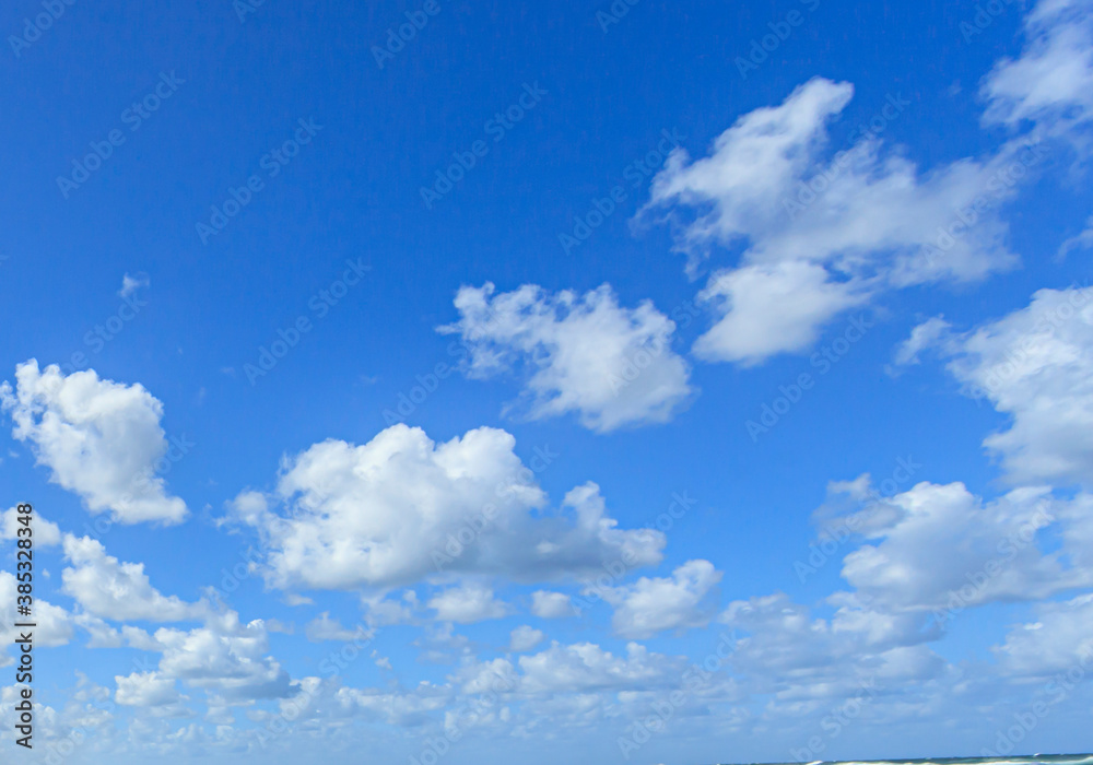 Image of a partly cloudy and partly clear sky during the day Image of a partly cloudy and partly clear sky during the day