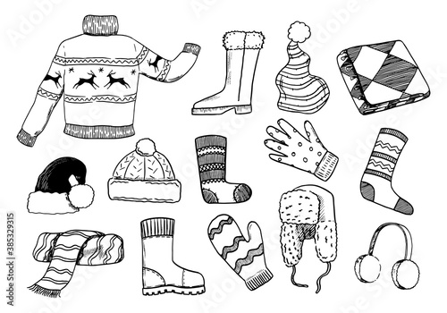 Doodles set of cozy winter clothes. Sweater, shoes, gloves, mittens, hats, scarf, socks. Hand drawn vector illustrations collection. Black outline elements isolated on white for design, decor, prints.