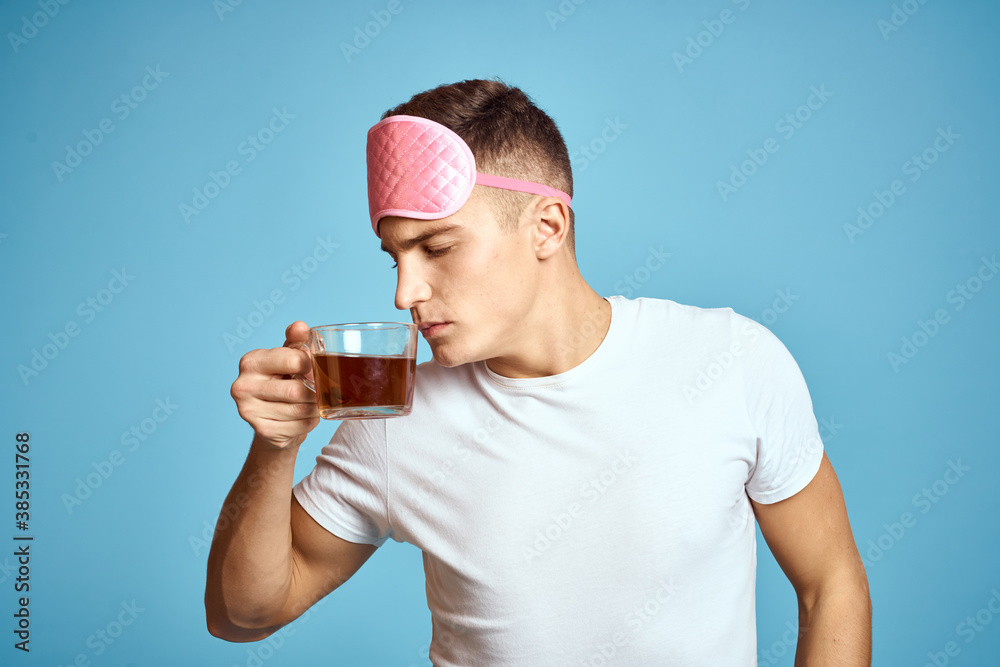man with pink sleep mask and cup of tea drink cheerfulness model breakfast man with pink sleep mask and cup of tea drink cheerfulness model breakfast