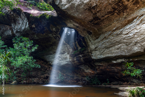 Saeng Chan Waterfall (Long Ru Waterfall), Ubon Ratchathani Province, Thailand.The stone holes are caused by water erosion due to sandstone being less resistant to corrosion.