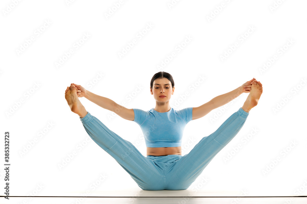 Fit yoga woman doing yoga pose, isolated on white background. Fit yoga woman doing yoga pose, isolated on white background.