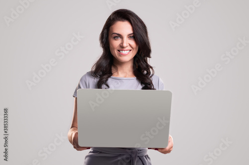 Smiling businesswoman working with laptop