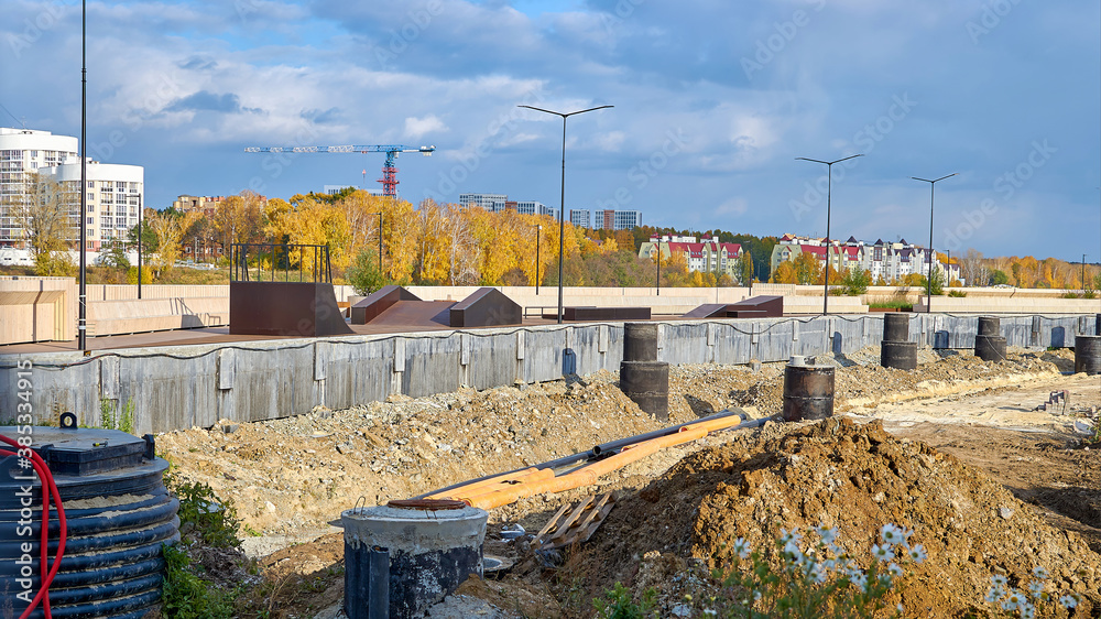 Construction works along the embankment. Construction of a skate Park