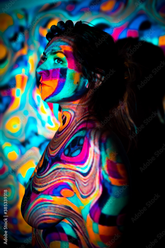 Fototapeta premium Trippy, Colorful Projector Portrait of Beautiful Nude Woman Model. Body Paint