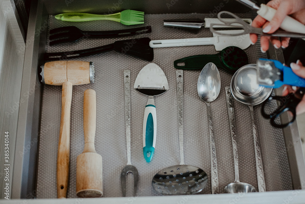 A set of Cutlery in a drawer. Correct placement of knives, forks and spoons in the drawer. Order in the kitchen. The concept of order in the house. A set of Cutlery in a drawer. Correct placement of knives, forks and spoons in the drawer. Order in the kitchen. The concept of order in the house.